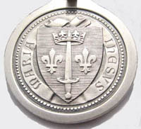back side of animported St. Joan medal/keychain