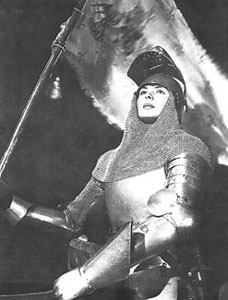 close up of Joan holding her banner